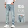 Jeans retro de alta gama para hombre de color claro para primavera, corte recto y holgado, nuevos pantalones para hombre elásticos lavados estilo primavera y otoño 2026