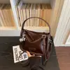 Bolso de hombro de moda versátil para mujer de verano 2026 transfronterizo, bolso cruzado popular, bolso cuadrado pequeño versátil para salir