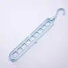Colgador de ropa multifuncional de nueve agujeros para almacenamiento en el hogar, soporte para armario, popular colgador mágico giratorio retráctil plegable de nueve agujeros