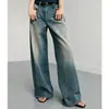 KAIM Jeans Baggy de Cintura Média-Baixa com Barra Reta e Efeito Film Washed - Lançamento Verão 2026