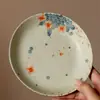 Bandeja de té de cerámica con diseño floral azul y blanco, patrón moteado rojo y forma redonda, adecuada para accesorios de ceremonia de té y uso doméstico