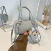 Bolso Boston tipo almohada para mujer 2026 Primavera Nueva Moda para el trabajo Estampado de dibujos animados Bolso de hombro único Cruzado