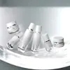 Botellas de vidrio para set de cuidado de la piel listas para enviar, serum, botellas con bomba para base de maquillaje, frascos para crema facial, materiales de empaque de vidrio de alta gama