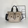 Bolsa de tela de nailon ligera estilo coreano Dongdaemun 2024 Nuevo Bolso Cubo Casual de Nicho Bolso de Hombro Versátil