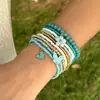 Novo Moda Boêmia Flor Amor Borboleta Pingente Corda Estampada Pérola de Imitação Pulseira Empilhada Conjunto Feminino