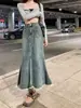 Falda vaquera estilo Hong Kong retro para mujer, nuevo modelo 2026, dobladillo deshilachado, longitud media, tiro alto, corte A adelgazante, falda vaquera ajustada