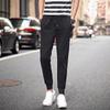 Pantalones casuales negros elásticos para adolescentes, pantalones ajustados de pierna pequeña con protección elástica, pantalones deportivos tipo bota para primavera y otoño para hombre