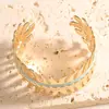 Pulsera geométrica calada de colores transfronteriza, lujo ligero con un toque de alta gama, pulsera abierta con goteo de aceite, accesorio de mano de diseño simple