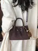 Bolso de mano transfronterizo, elegante bolso tipo cubo para mujer, nuevo bolso de hombro estilo coreano 2026, minimalista y de moda, bolso cruzado de nicho