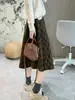 ¡El estilo de la falda es increíble! Falda de lana a cuadros retro para mujer, engrosada y cálida, cintura elástica, falda de longitud media, otoño e invierno, minifalda ajustada