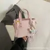 Bolso pequeño para mujer 2026 nuevo de moda popular bolso de mano tipo cubo versión coreana versátil bolso de hombro cruzado para mujer