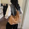 La nueva y exquisita y elegante bolsa de axila de gran capacidad para el día a día de Henggeng es un bolso de hombro casual y lindo, bolso de mano simple y versátil