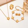 Popular en Europa y América, juego de joyería de cuatro piezas de trébol de cuatro hojas de doble cara, juego de accesorios de acero inoxidable, joyería simple y de alta gama