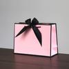 En stock embalaje lazo de regalo comercio exterior bolsa de papel portátil juego bolsa de papel para compras logo imprimible fabricante franqueo