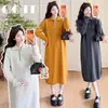 Ropa de maternidad otoño e invierno nuevo estilo Vestido de punto con cuello tipo polo medio botón largo holgado que cubre el vientre engrosado vestido de lana