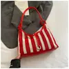 Bolsa Tote de Grande Capacidade com Listras Verticais Tecidas para Mulheres 2025 Verão Nova Bolsa de Ombro Bordada Bolsa de Axila em Cor Contrastante
