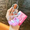 Novo chaveiro de feijãozinho de gelatina com óleo, maçã, fofo pingente de areia movediça, acessório de bolsa, pequeno presente, atacado de comércio exterior