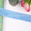 Venta al por mayor del fabricante Yiwu Trading presenta nuevos accesorios de encaje con flecos, accesorios para la ropa y encaje de borlas coloridas para cortinas