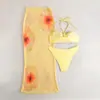 Bikini sexy de Amazon bikini de vacaciones europeo y americano ajustado top de tubo con cuello halter estampado falda larga traje de baño de tres piezas