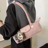 Bolso tipo baguette de lujo de nicho estilo francés, bolso tipo dumpling moderno y a la moda, adecuado para el uso diario, bolso versátil y moderno para hombro y debajo del brazo