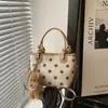 Moda fuente de fábrica transfronteriza 2026 nuevo diseño de lunares en nailon bolso de mano casual para el día a día bolso de hombro tipo cubo