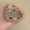 Pulsera de estrella multicapa de plata vintage arena y luna