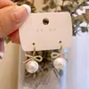 Pendientes de Perla de Circonita de Moda de Aguja Plateada Pendientes de Botón Retro de Lujo Ligero de Nicho Francés Pendientes Nuevos 2026