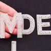 Europa y Estados Unidos parche adhesivo termofusible transfronterizo 26 letras decorativas de perlas en inglés letras de perlas con taladro caliente pegatinas de tela
