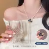 Un collar de trébol de cuatro hojas de diamante púrpura de dos vías, diseño desmontable, cadena larga versátil para suéter para mujer, accesorio popular de lujo ligero