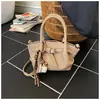 Bolso Cubo de Mano de Alta Gama Estilo Coreano para Mujer 2025 Invierno Nueva Moda Versátil para el Trabajo Hombro Cruzado