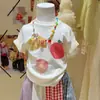 Blusas Infantis Estampadas de Manga Curta 2026 Primavera e Verão Novas Estilo Coreano Roupas Infantis Moda Feminina Camisetas Ins Conjuntos Casuais