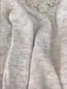 Suéter de Crochê com Padrão de Camélia Gola V Feminino Outono/Inverno 2026 Estilo Suave Coreano Solto Chique Top Rejuvenescedor