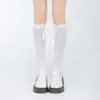 Calcetines de otoño Qianzhuo con mariposas negras estilo JK hasta la rodilla, medias blancas Lolita, calcetines blancos lechosos para la pantorrilla