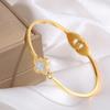 Pulsera de Acero de Titanio de Moda con Trébol de Cuatro Hojas Dorado, Nácar, Diamante Individual, Pulsera Abierta Elástica, Pulsera que No se Desvanece para Comercio Transfronterizo