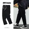 Pantalones vaqueros rectos de cordón para hombre, Pantalones largos versátiles casuales holgados de moda, Pantalones de pierna ancha retro estilo Hong Kong al por mayor