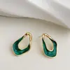 Atmósfera de alta gama pendientes ovalados retorcidos con esmalte retro francés lujo ligero estilo frío de alta gama pendientes extremadamente simples