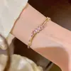 Pulsera transfronteriza nueva de imitación de oro para mujer, estilo de lujo ligero, incrustada con circonio de color, pulsera de estrella, joyería de nicho de alta gama al por mayor