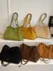 Bolso de mano elegante para mujer transfronterizo, nuevo modelo otoño 2026, bolso de mano para hombro o axila con un diseño único, adecuado para ir al trabajo