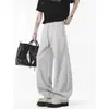 Pantalones de chándal de estilo americano desconstruidos con dobladillo curvo para hombre, marca de moda de otoño, pantalones casuales rectos de peso pesado, pantalones largos versátiles holgados de pierna ancha