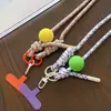 Estilo INS cuerda de colores dopamina pompón de pelo teléfono móvil bandolera moda llavero simple bolsa cordón largo creativo