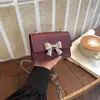 Mini 2026 Primavera/Verano Nuevo Lazo de Moda Cadena de Moda Versátil Hombro Único Cruzado Bolsa Cuadrada Pequeña