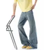 Calça jeans bordada de corte diagonal estilo americano para homens, calça reta casual com vibe de outono, calça larga desconstruída em patchwork solta