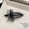 Corea del Sur exquisito pedrería malla negra lazo pin de pico de pato lujo ligero alta gama clip lateral flequillo accesorios para el cabello mujer