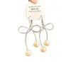 2026 Aretes Sencillos de Perla y Moño Huecos Modernos Elegantes Pinzas para Orejas para Niñas Aretes Únicos Exquisitos Venta al por Mayor para Mujeres