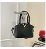 Bolsas Estilo Novo Primavera 2026 Moda Coreana Feminina Tendência Bolsa de Mão Alta Aparência Simples Feminina Grande Capacidade Bolsa de Ombro