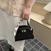 Bolsa Kelly Manual de Luxo Leve Estilo Coreano Nicho Simples Feminina 2026 Nova Bolsa de Ombro Único Bolsa Transversal Simples Venda por Atacado