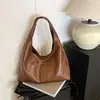 Bolsa de Ombro Vintage de Nicho para Mulheres 2026 Nova Tendência Versão Coreana Bolsa Tote Casual Versátil de Grande Capacidade