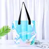 Bolsa de mão em PVC a laser com logotipo personalizado embalagem de roupas bolsa de mão plástica transparente colorida sacola de compras para presente