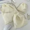Bolsa de almacenamiento de pana de color liso con cierre de cordón, un juego portátil de tres piezas de gran capacidad y una bolsa de almacenamiento simple