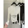 Elegante top de punto de manga larga con botones en la espalda y diseño calado, nuevo estilo de otoño 2026 para mujer, camiseta básica adelgazante con espalda abierta